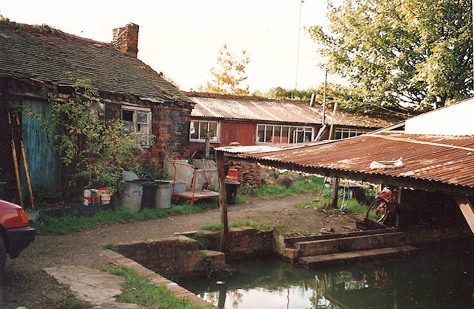 The forge building before high rise development behind it