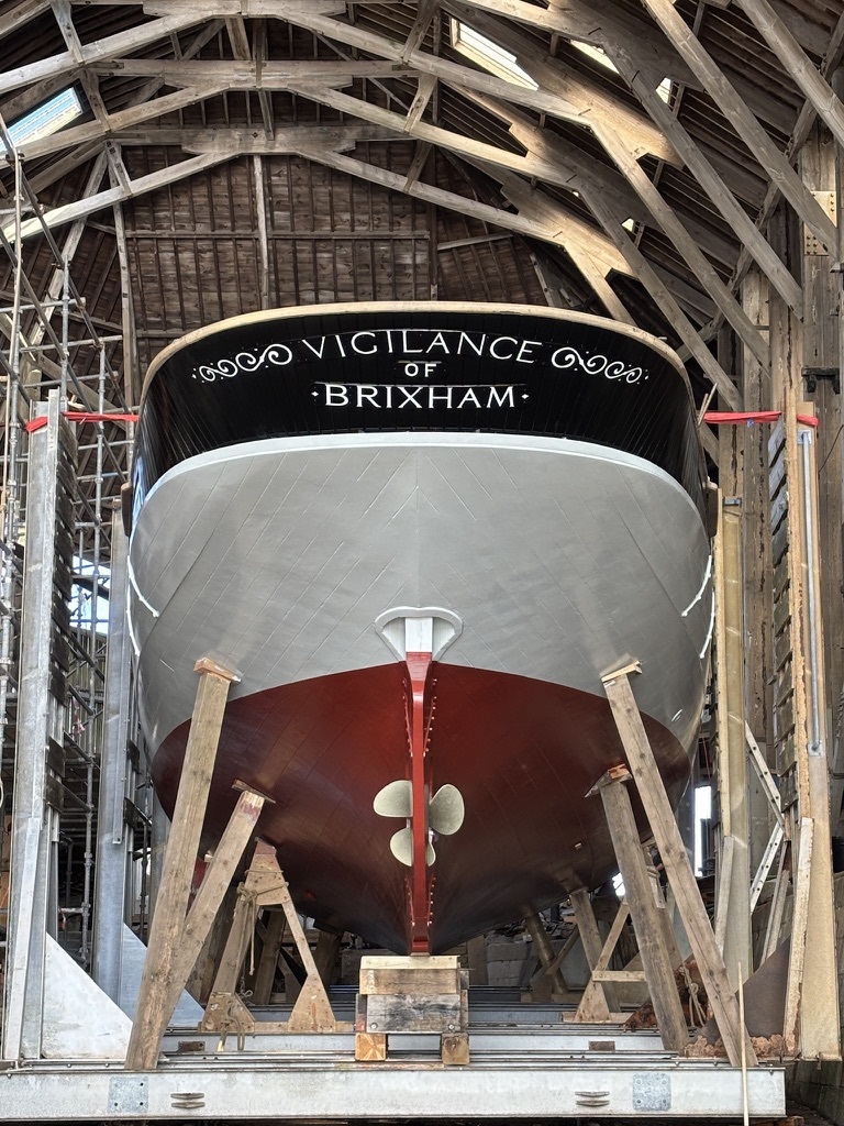 Stern view of Vigilance in the covered yard