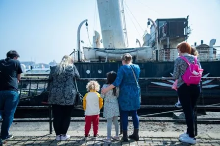 Visitors at Hartlepool Museum with PS Wingfield Castle in the background